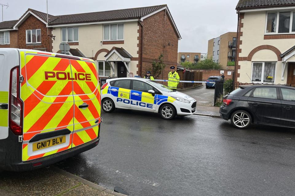Police officers at the scene in Priory Road, Dartford (PA Wire)