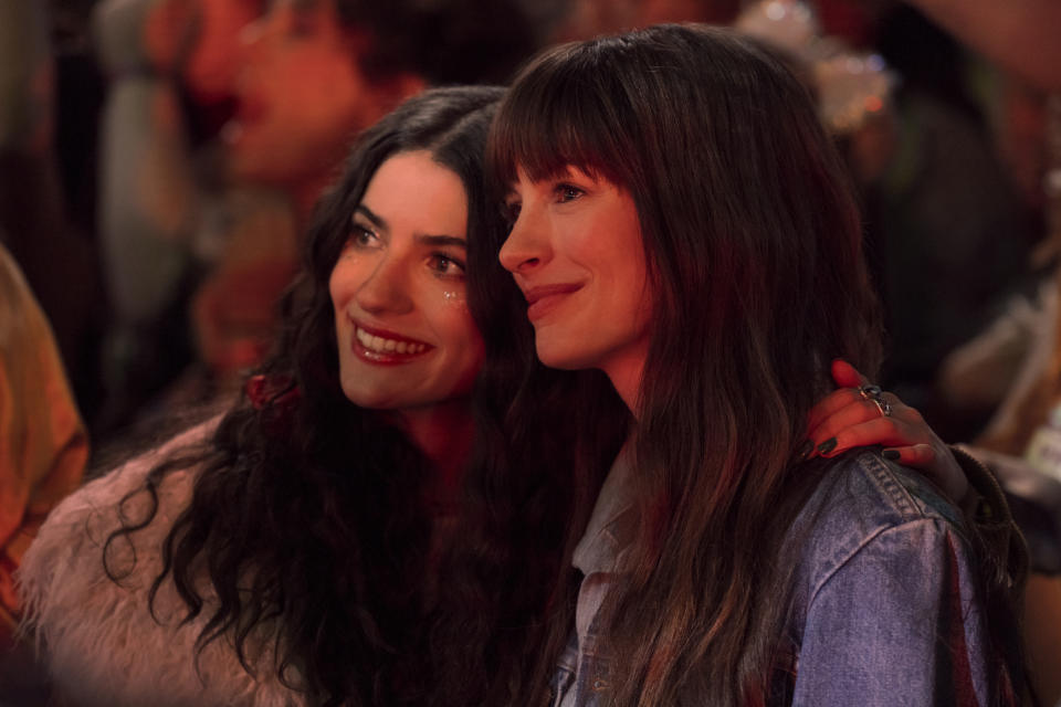 Anne Hathaway posing with another woman