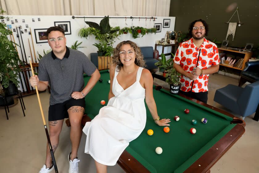 FULLERTON, CA - JULY 07: Siblings Juan Duran, 22, left, Carla Duran, 34, and Cesar Duran, 32, owners, at Semilla plant store on Thursday, July 7, 2022 in Fullerton, CA. The plant store owned by three siblings opened March 2021. (Gary Coronado / Los Angeles Times)