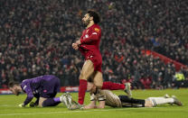 Liverpool's Mohamed Salah, centre, celebrates after scoring his side's second goal during the English Premier League soccer match between Liverpool and Manchester United at Anfield Stadium in Liverpool, Sunday, Jan. 19, 2020.(AP Photo/Jon Super)
