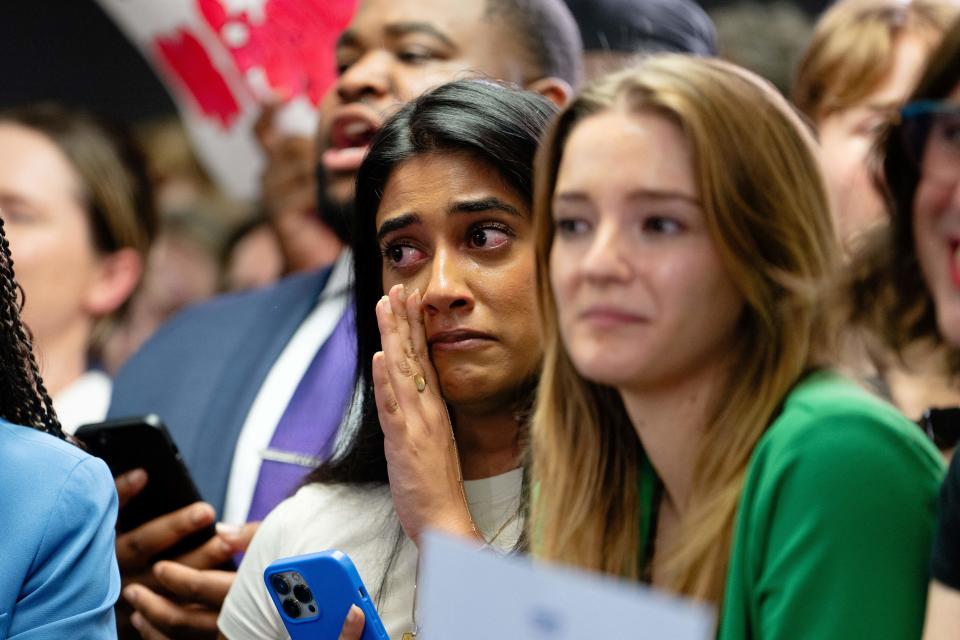 A woman cries as US President Joe Biden addresses campaign workers by phone before Vice President and Democratic presidential candidate Kamala Harris spoke at her campaign headquarters in Wilmington, Delaware, on July 22, 2024.