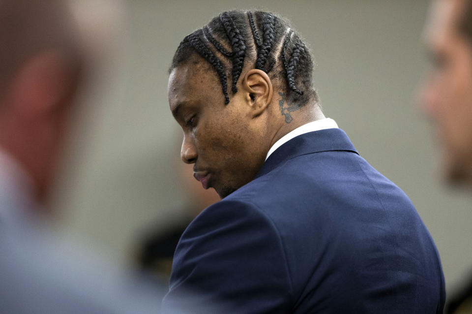 Former Las Vegas Raiders NFL football player Henry Ruggs III stands in the courtroom during his sentencing hearing at the Regional Justice Center, Wednesday, Aug. 9, 2023, in Las Vegas. Ruggs pleaded guilty May to felony DUI causing death and misdemeanor vehicular manslaughter. (Steve Marcus/Las Vegas Sun via AP)