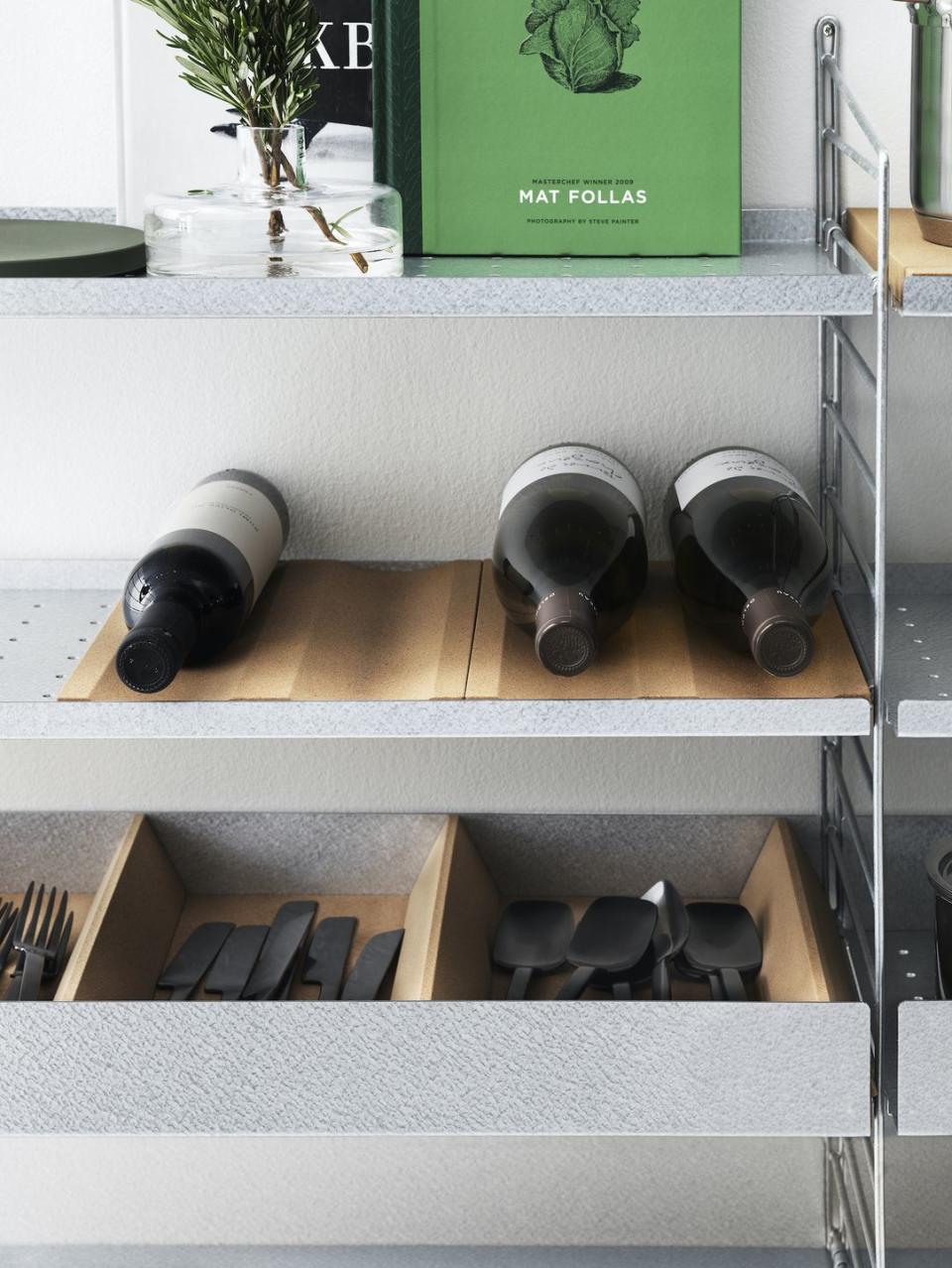 <p>Both renewable and biodegradable, versatile cork is making its way into the modern kitchen. </p><p>Bo Hellberg, CMO at String Furniture, comments: 'Cork is a material part of the “<a href="https://www.housebeautiful.com/uk/decorate/a30490910/biophilic-design/" rel="nofollow noopener" target="_blank" data-ylk="slk:biophilia;elm:context_link;itc:0;sec:content-canvas" class="link ">biophilia</a>” trend, where we seek to connect with nature and organic materials and plant life, in our homes. It is obviously inherently sustainable and brings warmth and texture to any surface or space, but it’s also ideal for insulating, which makes it great for kitchens.</p><p>'Cork is a great match for our metal shelves, taming the industrial look. It combines the Scandi kitchen interior with a softer, organic material.'</p><p>Pictured: String system cork bottle tray, <a href="https://www.utilitydesign.co.uk/string-cork-bottle-rack-divider-mat" rel="nofollow noopener" target="_blank" data-ylk="slk:String Furniture;elm:context_link;itc:0;sec:content-canvas" class="link ">String Furniture</a></p>