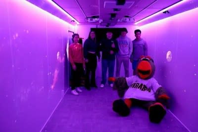 Students from Charterers Valley High School and a Pittsburgh Pirate parrot get their first look inside the Chill Mobile.