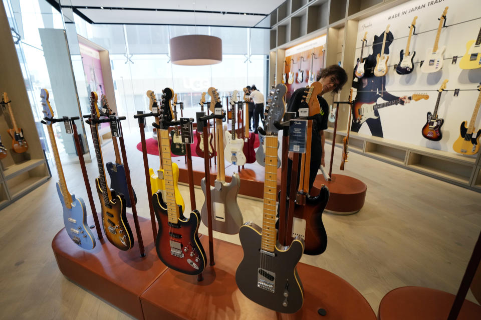 Fender guitars are on display at the opening ceremony of its Tokyo store Thursday, June 29, 2023. Fender, the guitar of choice for some of the world’s biggest stars from Jimi Hendrix to Eric Clapton, is opening what it calls its “first flagship store” in its 77-year history. (AP Photo/Eugene Hoshiko)