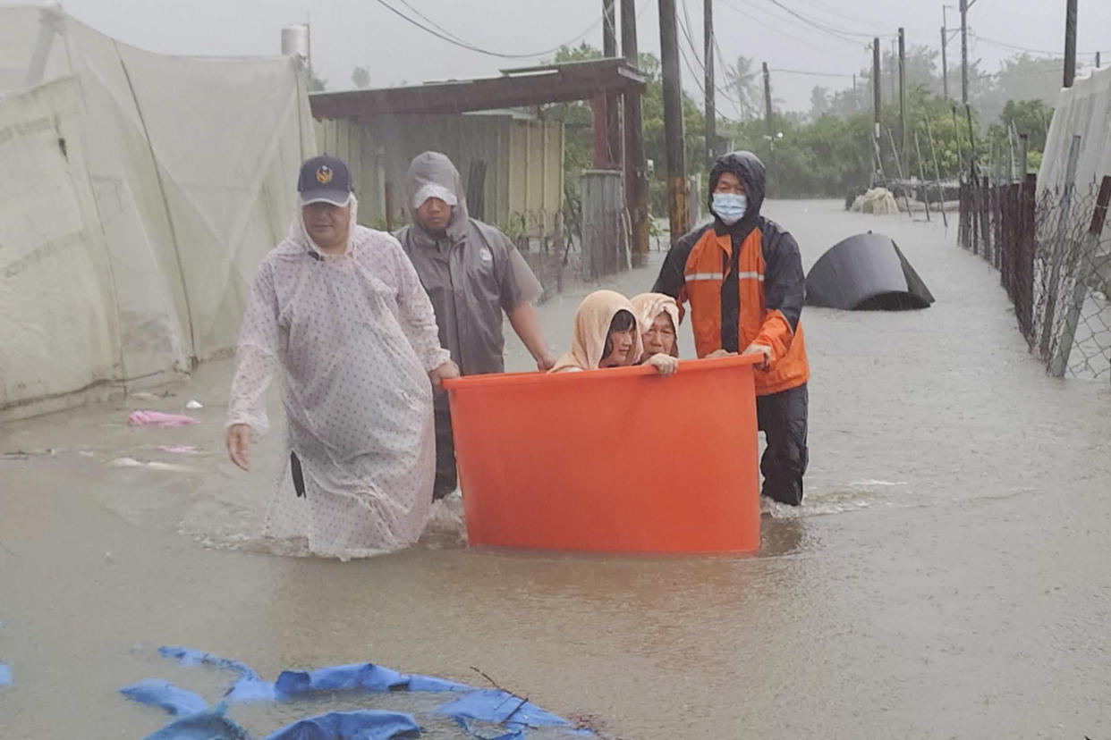 Residents are evacuated during floods after Typhoon Gaemi made landfall in Taiwan on Thursday. 