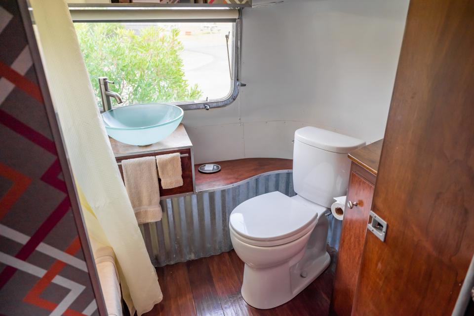 toilet next to window in airstream