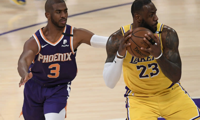 Lakers star LeBron James being guarded by Chris Paul.