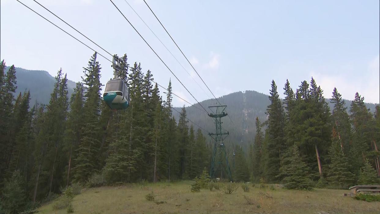 Riders of the Banff Gondola were stuck in cabins and at the mountain's summit for a time yesterday when the power operating the lift was cut by a storm. The gondola runs up about 700 metres in elevation to the summit of Sulphur Mountain above the townsite.  (CBC - image credit)