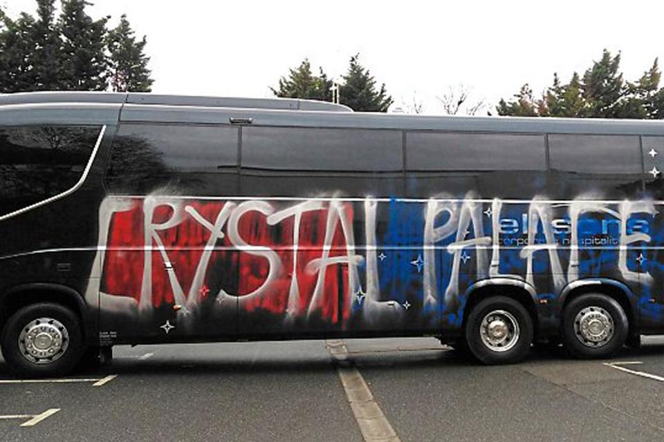 Spray it ain't so... Palace fans vandalise their own team coach by mistake