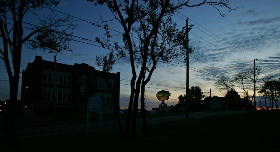 The Haunted Schoolhouse offers an imposing silhouette at dusk in 2009 on Triplett Boulevard in Akron.