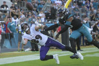Jacksonville Jaguars safety Andre Cisco (5) breaks up a pass intended for Baltimore Ravens tight end Mark Andrews (89) during the second half of an NFL football game, Sunday, Nov. 27, 2022, in Jacksonville, Fla. (AP Photo/Phelan M. Ebenhack)