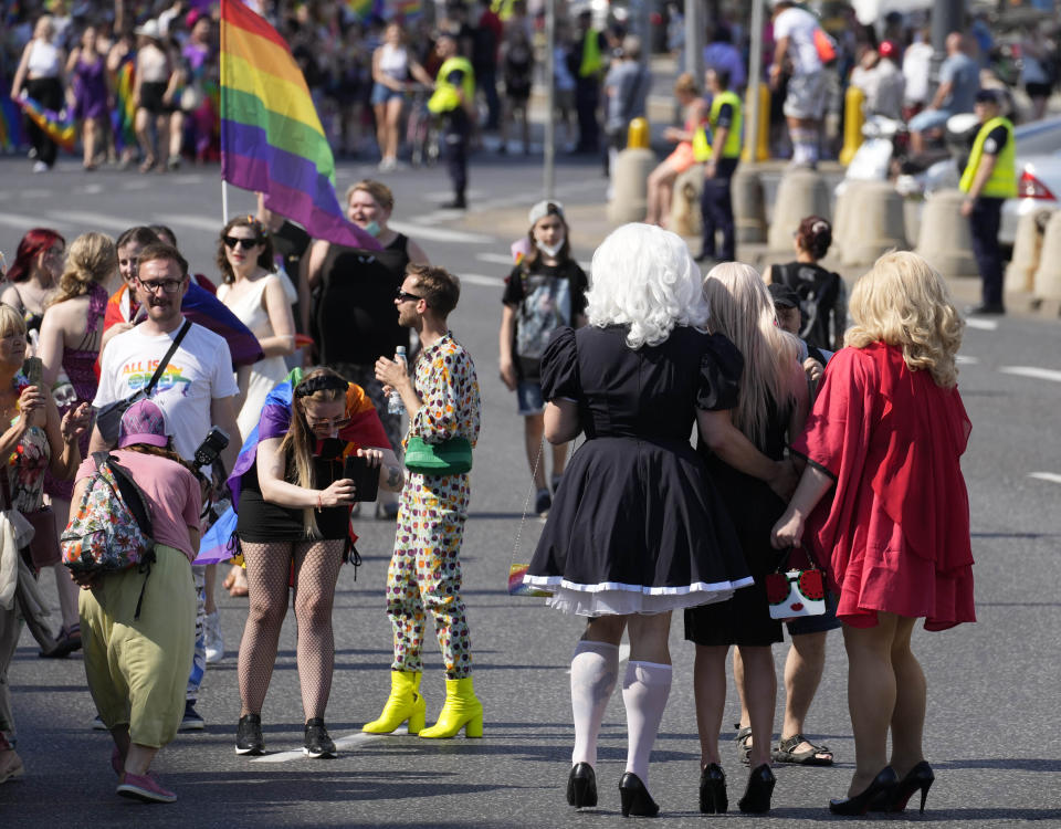 People take part in the Equality Parade, the largest gay pride parade in central and eastern Europe, in Warsaw, Poland, Saturday June 19, 2021. The event has returned this year after a pandemic-induced break last year and amid a backlash in Poland and Hungary against LGBT rights.(AP Photo/Czarek Sokolowski)