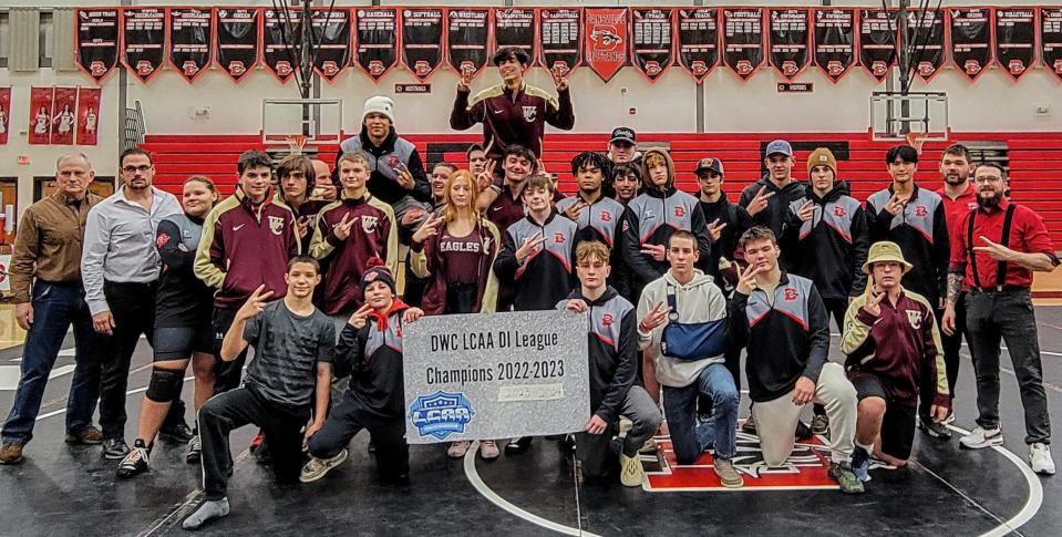 The Dansville-Wayland-Cohocton wrestling program celebrates after defeating Haverling Wednesday night to claim the program's first-ever back-to-back Livingston County Division I league titles.