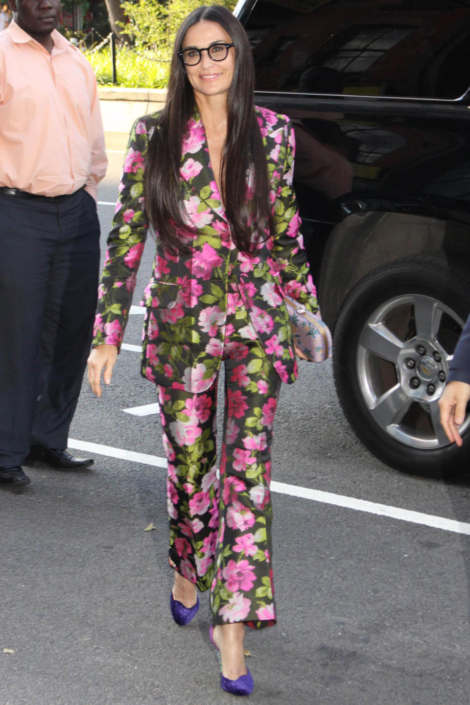 <p><strong>26 June</strong> Demi Moore opted for a playful floral patterned suit for the event. </p>