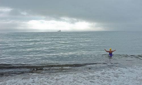 Woman in sea, Falmouth, Cornwall, England