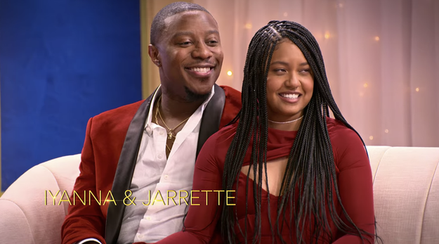 Iyanna and Jarrette sitting on a couch for an interview