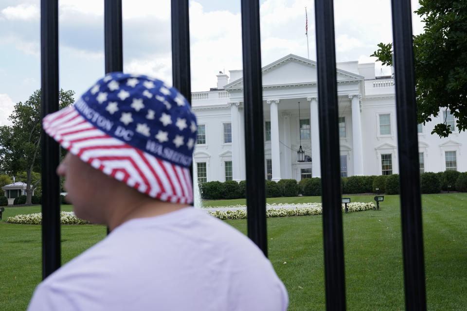 FILE - The North Lawn of the White House is seen from a newly reopened section of Pennsylvania Avenue, July 4, 2021, in Washington. A White House tour is practically a must-do in Washington, though the experience can leave some guests asking questions about spaces they don’t get to see, like the Oval Office. The White House Historical Association has a plan to answer those questions when it opens “The People’s House: A White House Experience,” in the fall of 2024. (AP Photo/Patrick Semansky, File)