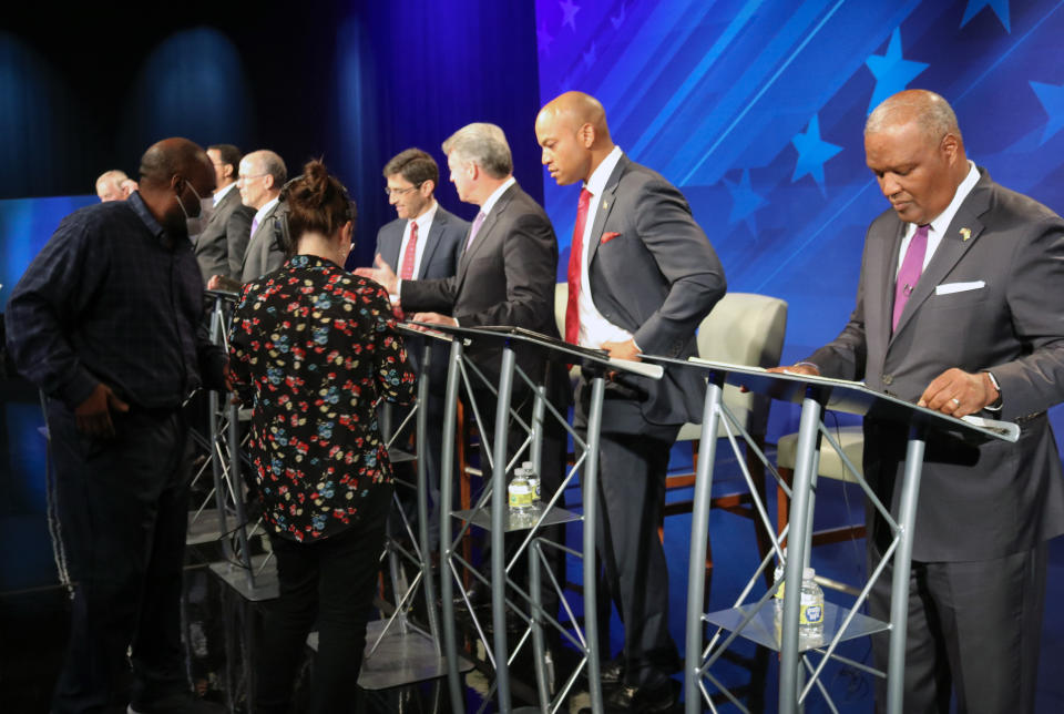 FILE - From right, Rushern Baker, Wes Moore, Doug Gansler and Jon Baron stand at their podiums just before a debate of eight candidates seeking the Democratic nomination for governor of Maryland on Monday, June 6, 2022 in Owings Mills, Md. The Republican primary in Maryland is being held Tuesday, July 19. (AP Photo/Brian Witte, File)