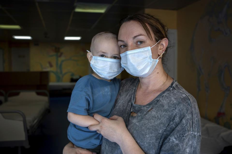 Oksana Halak poses for a portrait with her son Dmytro, 2, at the National Cancer Institute in Kyiv, Ukraine, Wednesday, July 10, 2024. Dmytro is one of 31 young patients battling cancer who were relocated to the hospital from Okhmatdyt Children’s Hospital after it was struck by a Russian missile this week. (AP Photo/Alex Babenko)