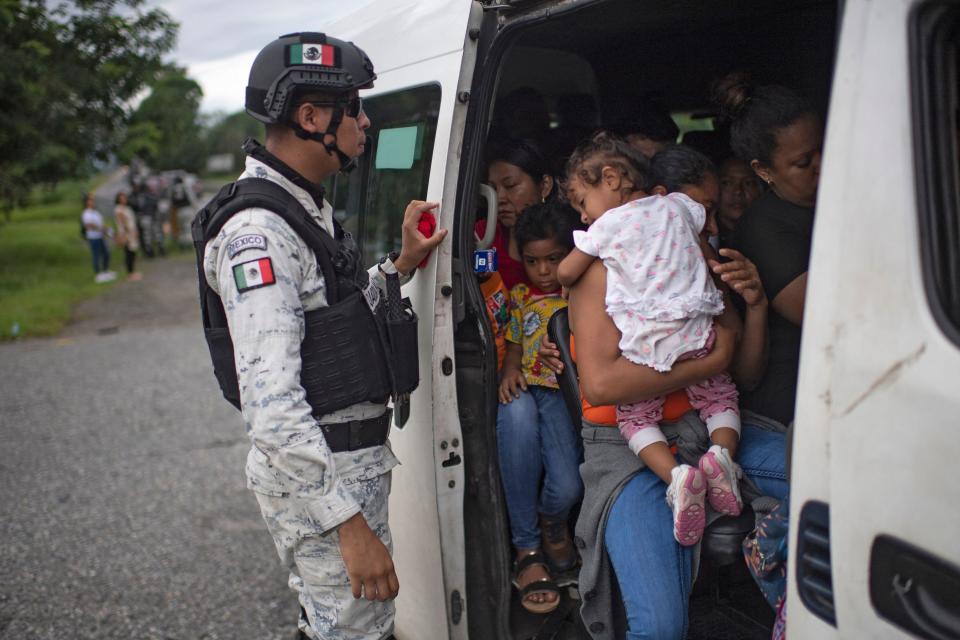 Members of Mexico's National Guard stop a public transport van to ask passengers for documents and find migrants taking part in a caravan heading to the U.S., on the road from Huixtla to Escuintla, in Chiapas state, Mexico, on June 9, 2022.  / Credit: PEDRO PARDO/AFP via Getty Images