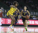 West Virginia guard Kysre Gondrezick, right, drives on Baylor guard DiDi Richards in the first half of an NCAA college basketball game, Monday, March 8, 2021, in Waco, Texas. (Rod Aydelotte/Waco Tribune-Herald via AP)