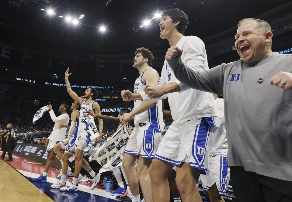 Duke players celebrate during a first-round college basketball game against Oral Roberts in the NCAA Tournament, Thursday, March 16, 2023, in Orlando, Fla. (Stephen M. Dowell/Orlando Sentinel via AP)