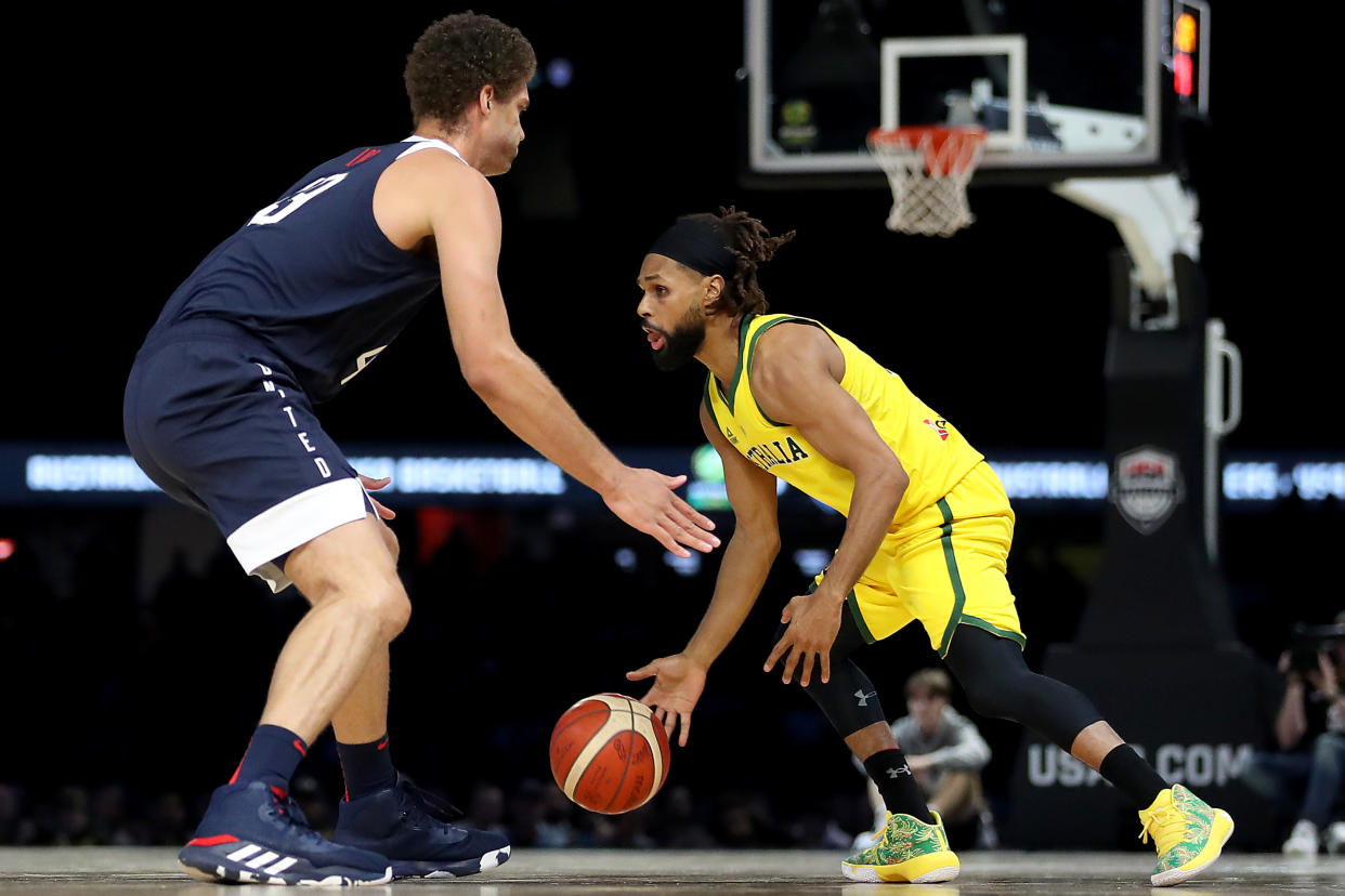 MELBOURNE, AUSTRALIA - AUGUST 24: Patty Mills of the Boomers and Brook Lopez of USA in action during game two of the International Basketball series between the Australian Boomers and United States of America at Marvel Stadium on August 24, 2019 in Melbourne, Australia. (Photo by Jonathan DiMaggio/Getty Images)