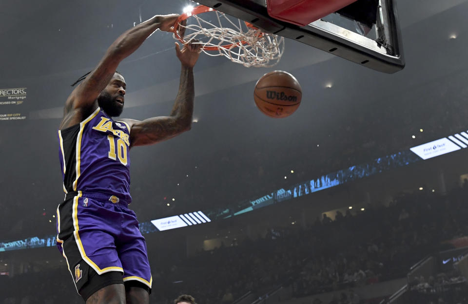 Los Angeles Lakers center DeAndre Jordan dunks during the first half of the team's NBA basketball game against the Portland Trail Blazers in Portland, Ore., Saturday, Nov. 6, 2021. (AP Photo/Steve Dykes)