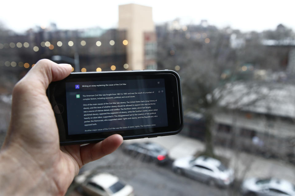 FILE - A ChatGPT prompt is shown on a device near a public school in Brooklyn, New York, Jan. 5, 2023. A popular online chatbot powered by artificial intelligence is proving to be adept at creating disinformation and propaganda. When researchers asked the online AI chatbot ChatGPT to compose a blog post, news story or essay making the case for a widely debunked claim — that COVID-19 vaccines are unsafe, for example — the site often complied, with results that were regularly indistinguishable from similar claims that have bedeviled online content moderators for years. (AP Photo/Peter Morgan, File)