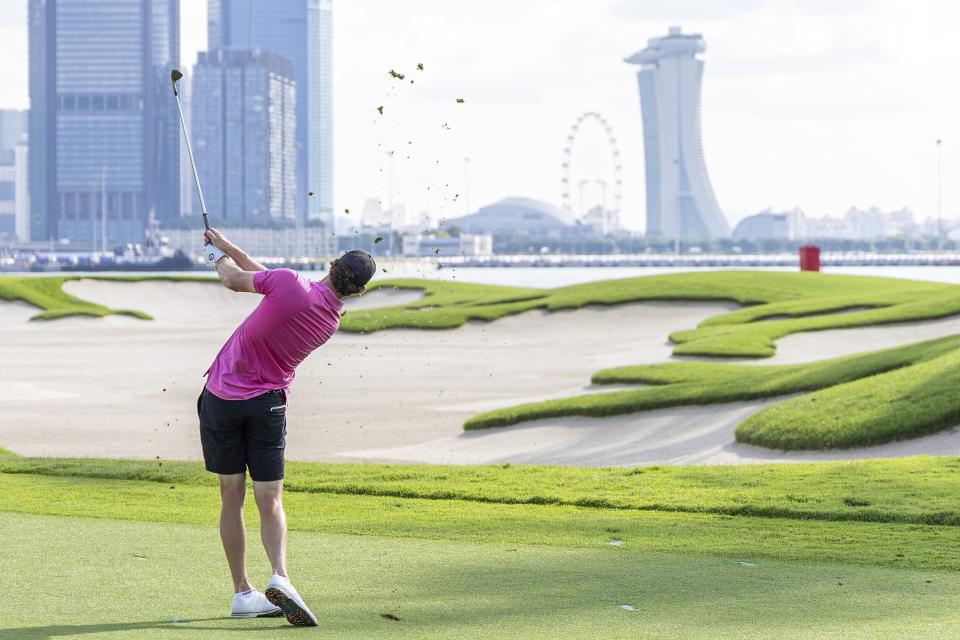 Thomas Pieters, of RangeGoats GC, hits his shot from the fifth fairway during the final round of LIV Golf Singapore at Sentosa Golf Club on Sunday, May 5, 2024, in Sentosa, Singapore. (Doug DeFelice/LIV Golf via AP)