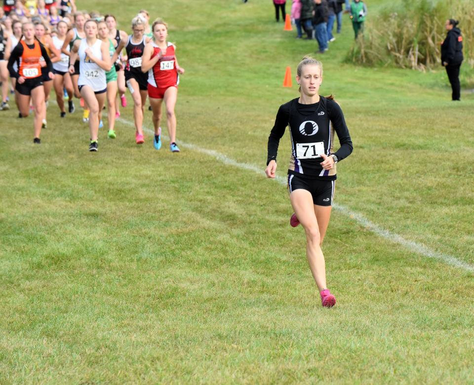 Onsted's Emmry Ross runs away from the pack during Saturday's Hudson Boosters Invite.