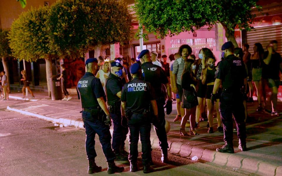 Police are called to the party strip Punta Ballena to deal with rowdy British drinkers as the tourists begin to return to Magaluf in Majorca  - MTE/SOLARPIX.COM