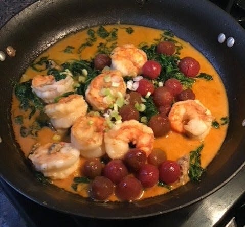 Barry Fleischmann's shrimp and heirloom tomato with saffron-roasted garlic sauce.