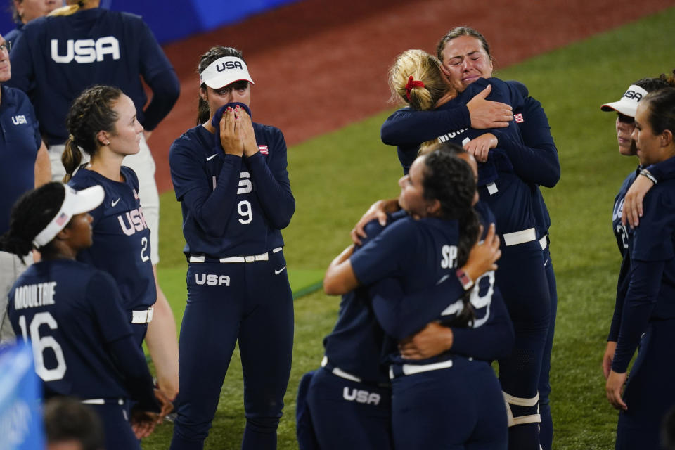 Members of team United States react after a softball game against Japan at the 2020 Summer Olympics, Tuesday, July 27, 2021, in Yokohama, Japan. Japan won 2-0. (AP Photo/Matt Slocum)