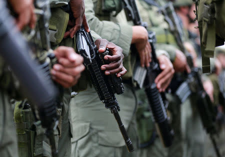 Colombian anti-narcotics police officers stand in formation before the embarking for anti-narcotics operations in San Jose del Guaviare, Colombia, August 2, 2016. REUTERS/John Vizcaino