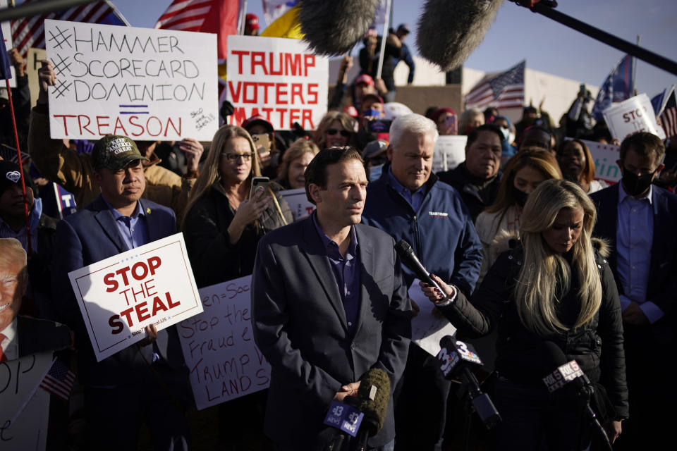 Former Nevada Attorney General Adam Laxalt speaks during a news conference outside of the Clark County Election Department, Sunday, Nov. 8, 2020, in North Las Vegas. (AP Photo/John Locher)