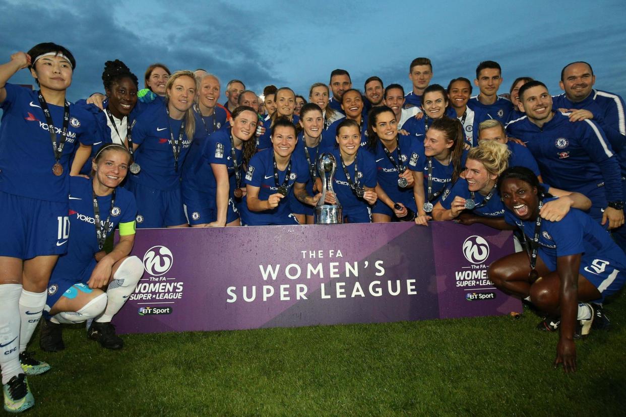 Chelsea celebrate after becoming Super League champions: PA