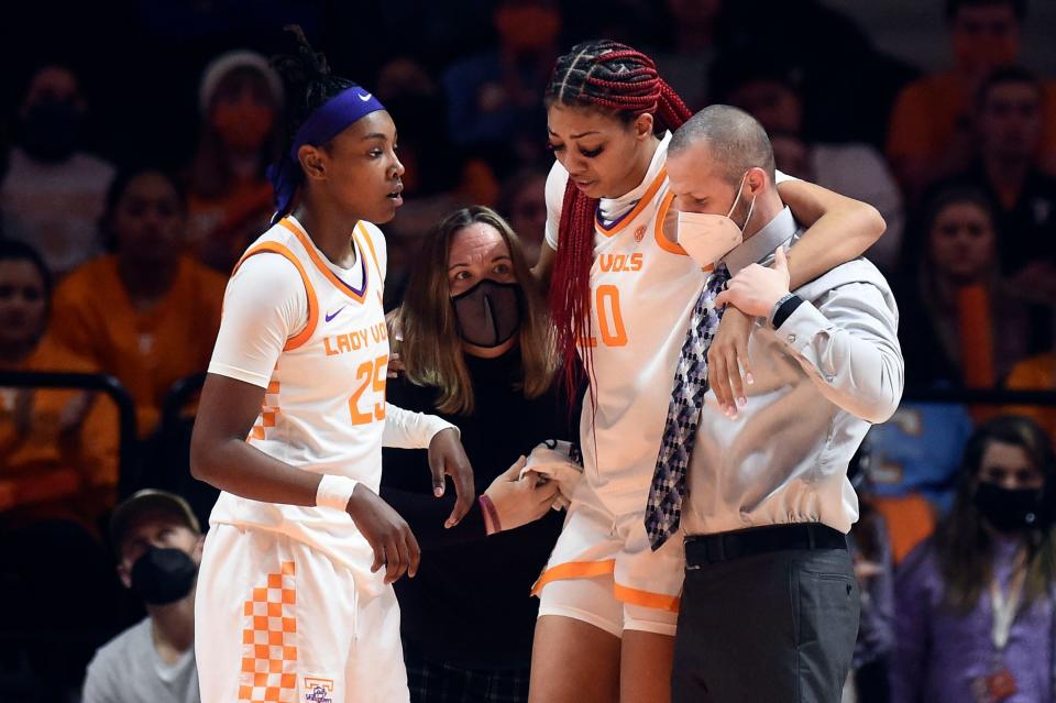 Tennessee center Tamari Key (20) is helped off the court during the NCAA basketball game between the Tennessee Lady Vols and Kentucky Wildcats in Knoxville, Tenn. on Sunday, January 16, 2022.