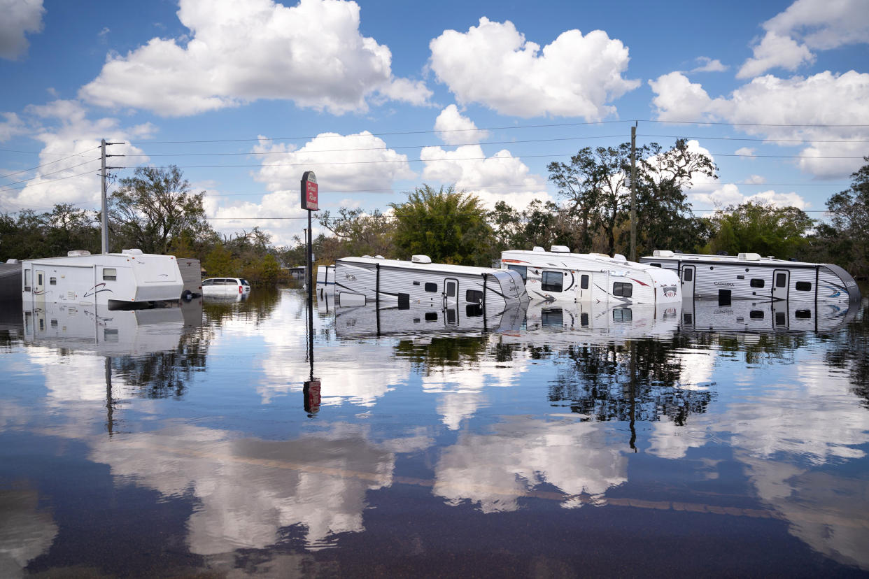 Flooded travel trailers at the Peace River Campground, in Arcadia, Fla., on Oct. 4, 2022. Fifty miles inland, and nearly a week after Hurricane Ian made landfall on the gulf coast of Florida, the record breaking floodwaters in the area are receding to reveal the full effects of the storm. (Photo by Sean Rayford/Getty Images) (Sean Rayford / Getty Images)