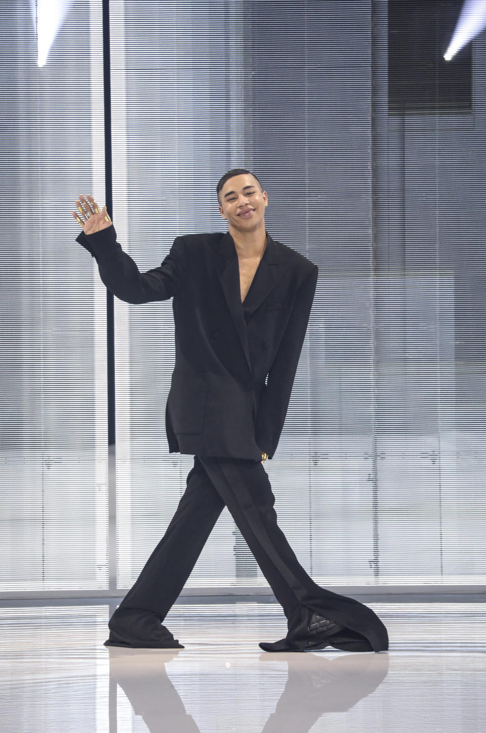 Olivier Rousteing accepts applause at the conclusion of the Balmain Spring-Summer 2022 ready-to-wear fashion show presented in Paris, Wednesday, Sept. 29, 2021. (Photo by Vianney Le Caer/Invision/AP)