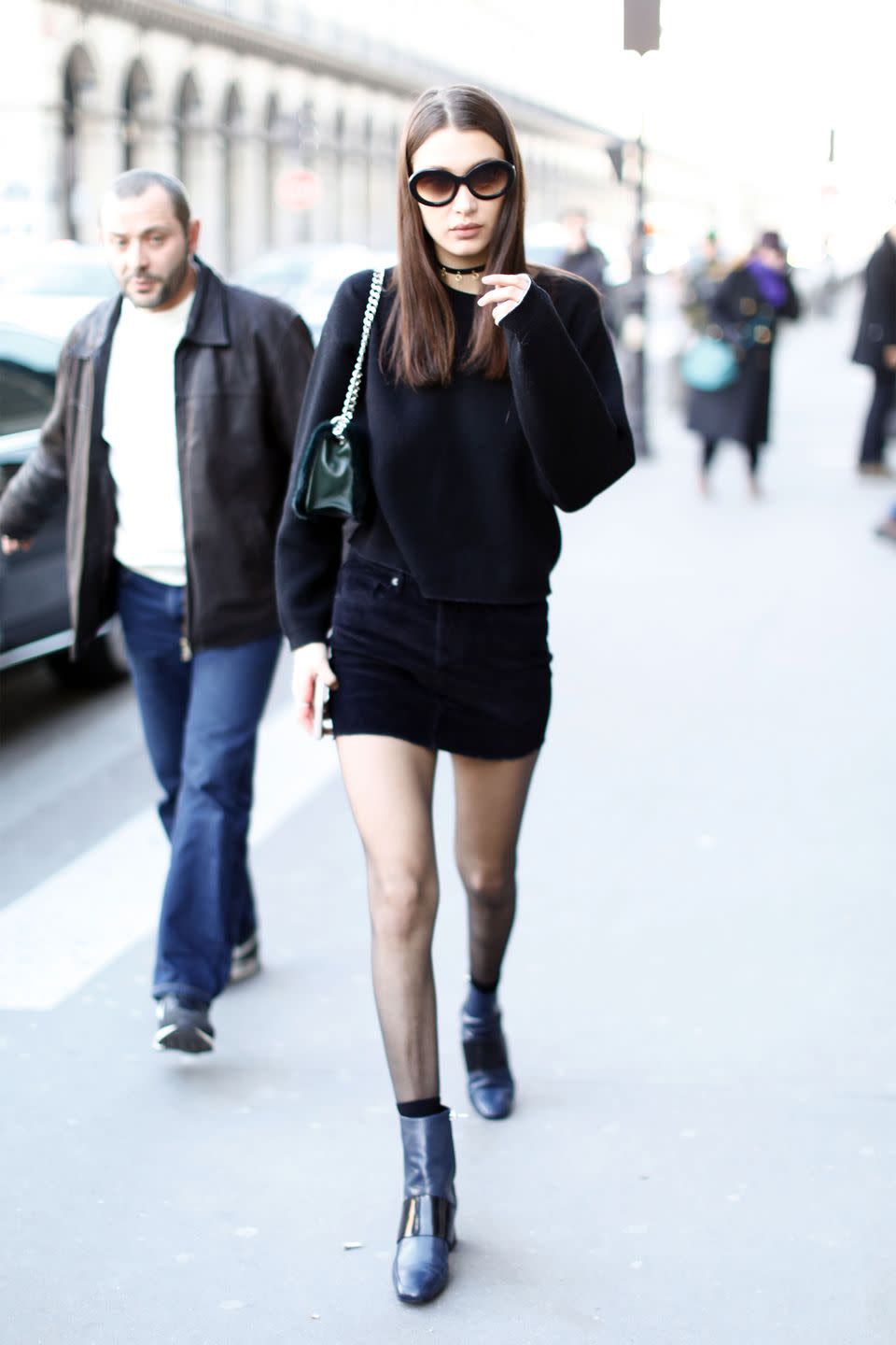 <p>In a black sweater, black mini skirt, ASKA leather boots, choker, rounded Sunday Somewhere sunglasses and olive green bag while out in Paris.</p>