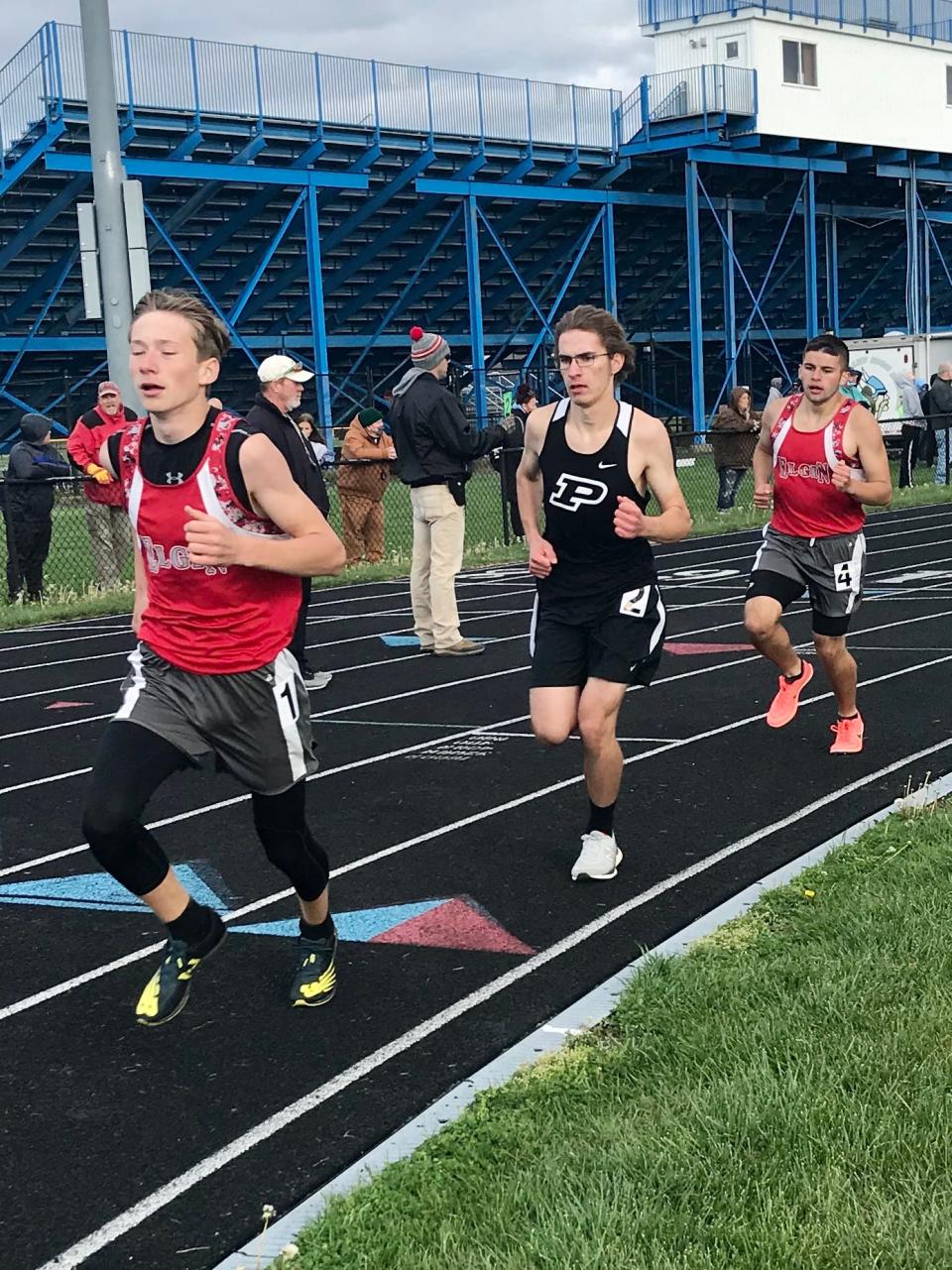 Elgin's Ethan Marshall, left and Sage Brewer run the boys 1600 meters during the Marion County Meet at River Valley last year.