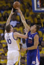 Los Angeles Clippers' Blake Griffin, right, blocks a shot from Golden State Warriors' David Lee (10) during the first half in Game 3 of an opening-round NBA basketball playoff series, Thursday, April 24, 2014, in Oakland, Calif. (AP Photo/Marcio Jose Sanchez)