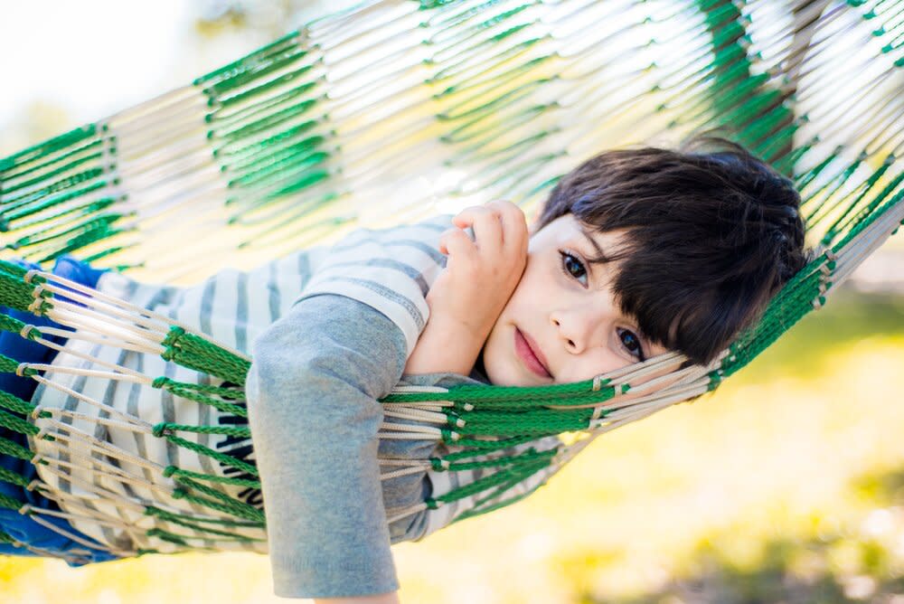 bored boy in hammock