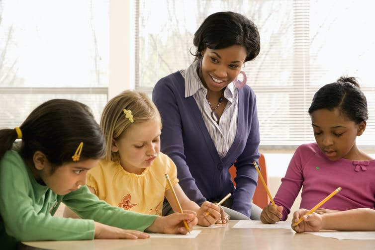 <span class="caption">Learning in small groups may benefit children with SEN.</span> <span class="attribution"><a class="link " href="https://www.shutterstock.com/image-photo/teacher-helping-students-school-classroom-horizontally-44513719" rel="nofollow noopener" target="_blank" data-ylk="slk:iofoto/Shutterstock;elm:context_link;itc:0;sec:content-canvas">iofoto/Shutterstock</a></span>