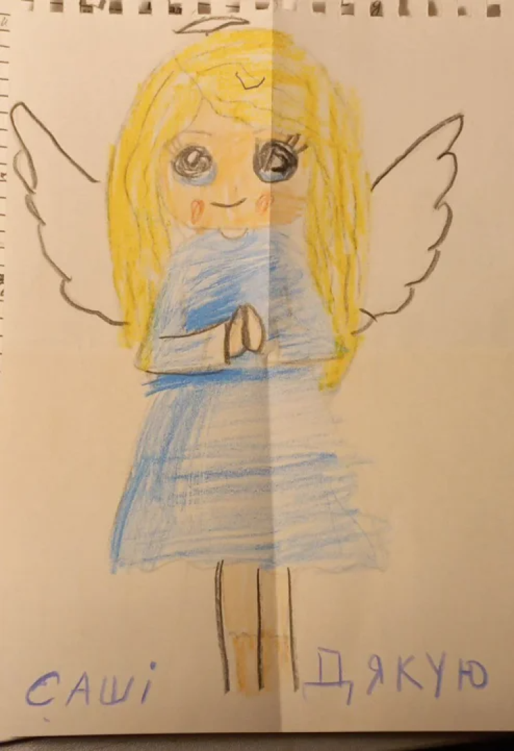 Oleksandr says the wives of other defenders call him their "guardian angel". This picture was given to him by the child of one of his combat friends. <span class="copyright">Courtesy of Oleksandr</span>