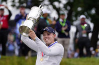 Matthew Fitzpatrick, of England, celebrates with the trophy after winning the U.S. Open golf tournament at The Country Club, Sunday, June 19, 2022, in Brookline, Mass. (AP Photo/Julio Cortez)