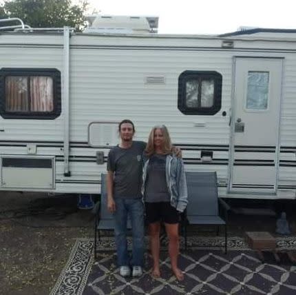 Kim Coulon and her boyfriend stand in front of the RV that they've been living in since the Camp fire and that is currently parked in Durham, California. (Photo: Courtesy of Kim Coulon)