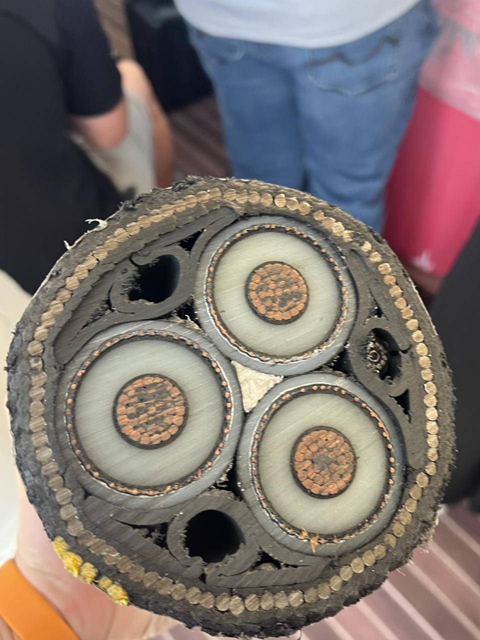 A look at the inside of one of the 11.5 inche diameter cables that will carry the power underwater to Virginia Beach (WAVY Photo/Brett Hall)